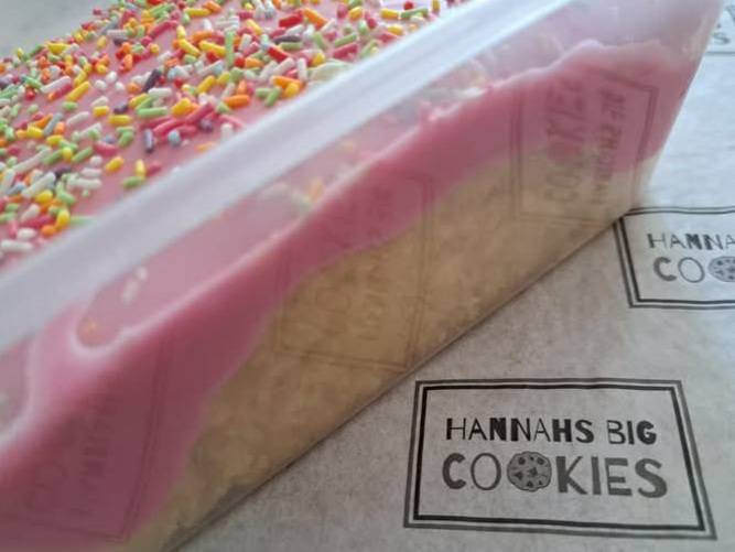 Old school vanilla sponge with pink icing and sprinkles.